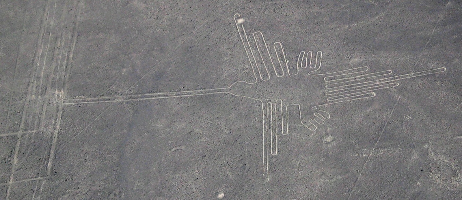 The Nazca hummingbird geoglyph, southern Peru — one of the vast desert figures legible in full only from the air. (CC BY-SA 3.0)