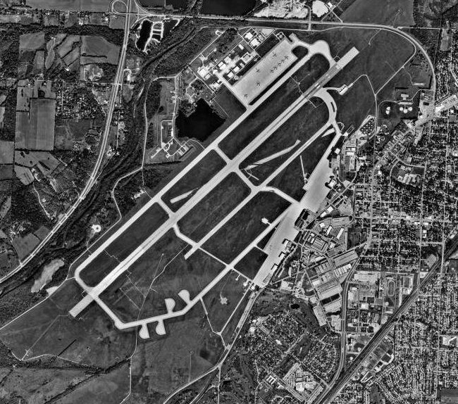 An aerial view of Wright-Patterson — the place where, per Ed Ruppelt's later account, Grudge staff routinely closed cases by attributing them to weather balloons, aircraft, or witness error.